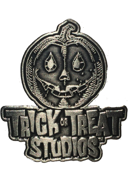 Enamel Pin.  Antique steel finish.  Jack o' lantern with smiling mouth, above text that reads Trick or Treat Studios.