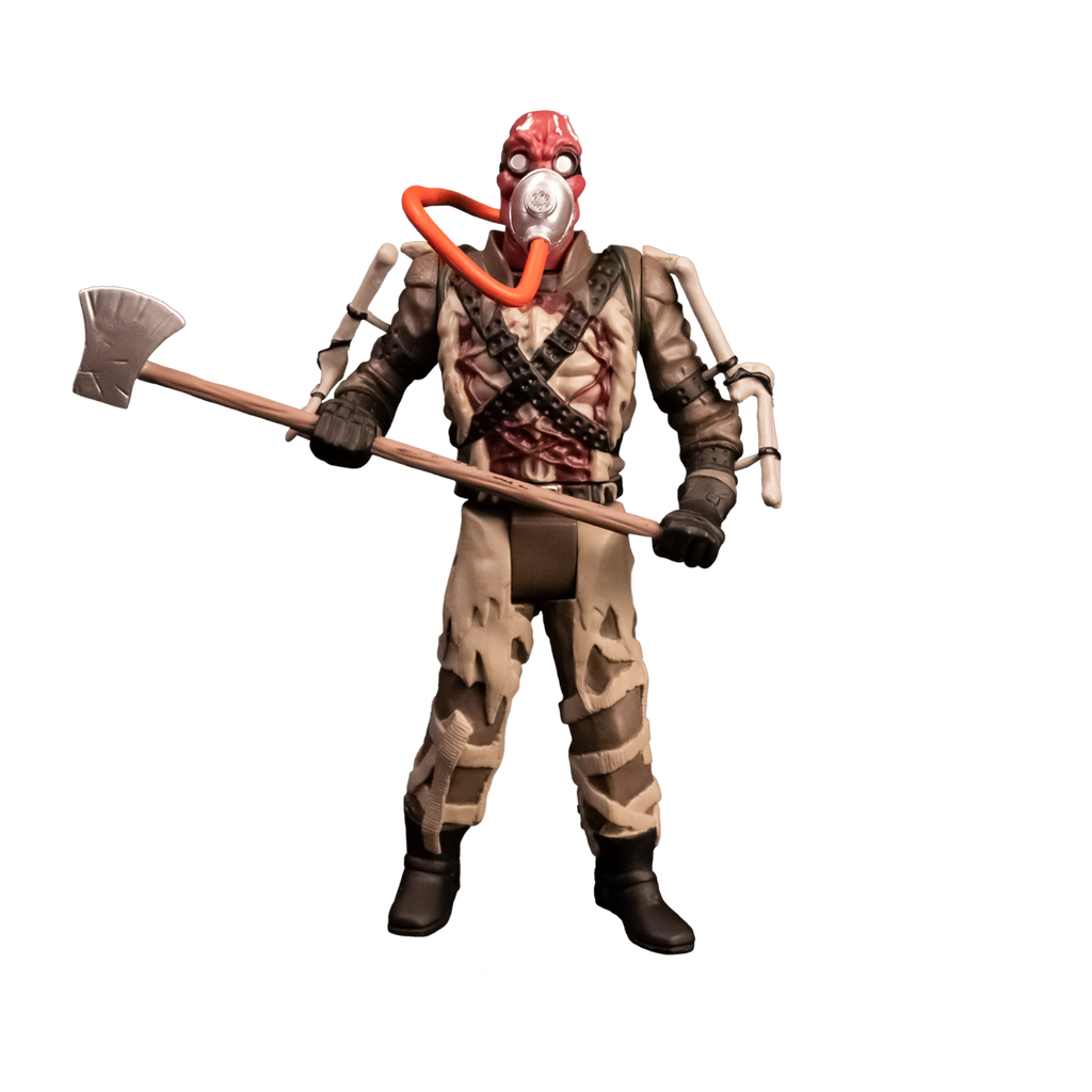 Action figure. Front view. Person with red head, wearing goggles and oxygen mask with orange hose. Tattered brown and tan outfit, apparatus attached to arms, ammunition belts across chest, black gloves and boots. Holding large Axe.