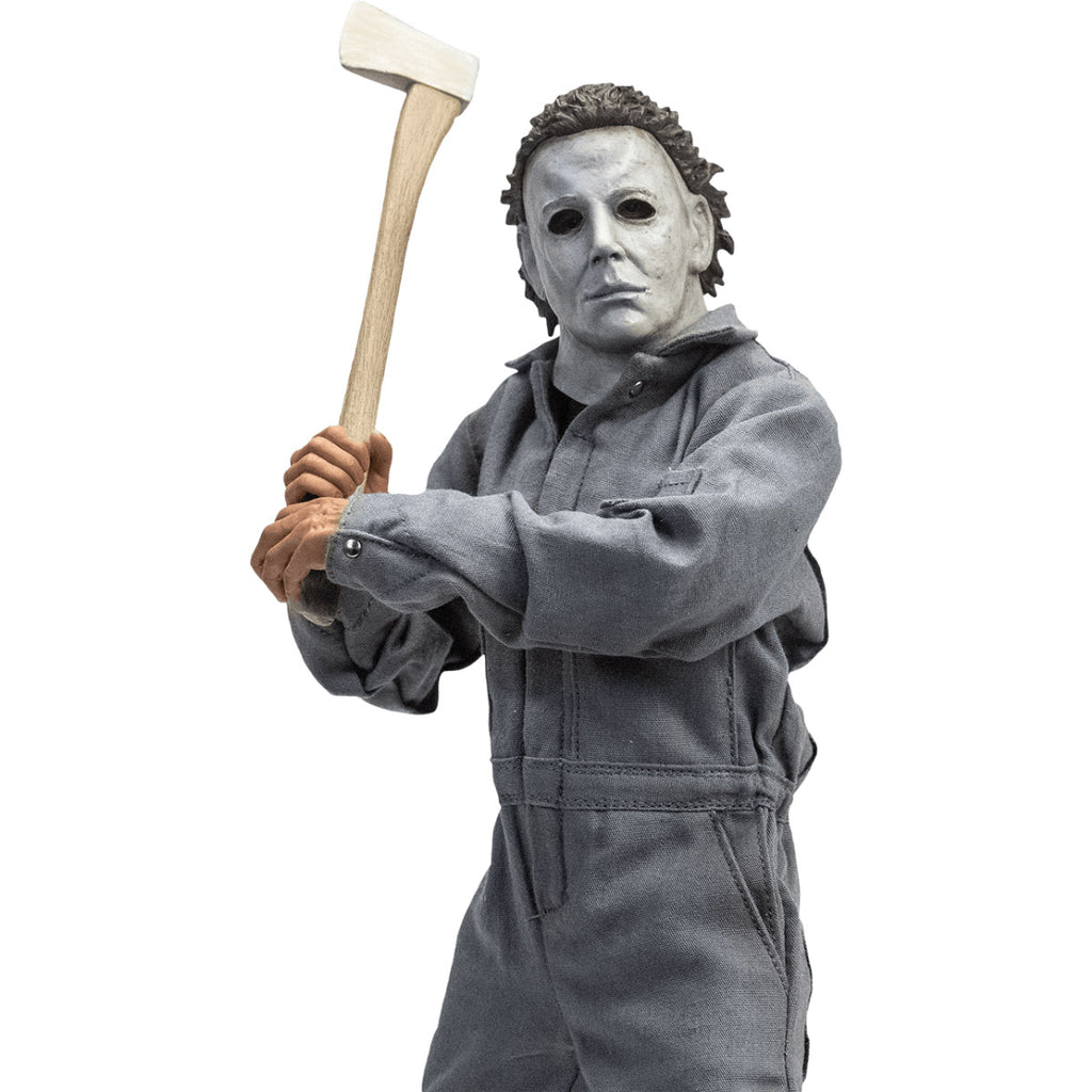 Front view. Halloween 6 Michael Myers 12" figure. White mask brown hair, wearing coveralls, holding axe