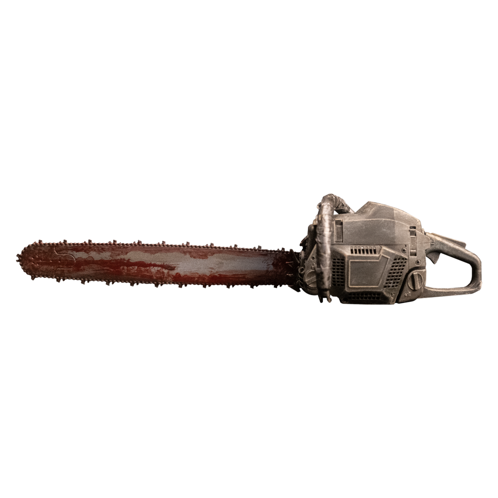 Chainsaw accessory.  Silver machine body. Bloodstained bar and chain.