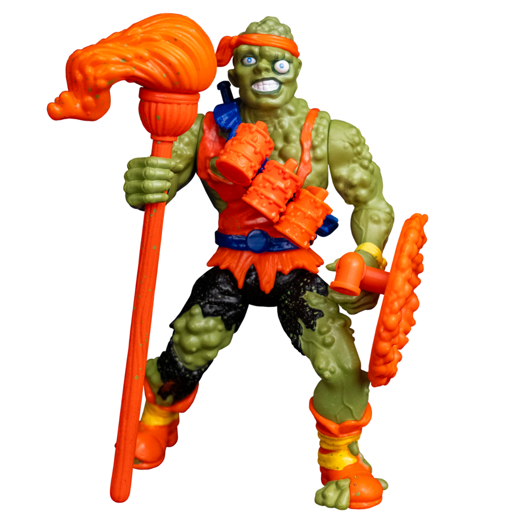 Toxie action figure, front view. Green, lumpy, muscular humanoid figure. Bald, green blistered flesh, bright orange headband tied on forehead. Misaligned blue eyes, crooked nose. Lips open, large teeth. Wearing tattered orange tank top and black pants, blue belt, orange and yellow battered boots. red, white and blue wrist band on right wrist, yellow wristband on left wrist.  Accessories, orange mop in right hand, orange shield in left hand.  Blue bandolier on chest holding orange cannisters.