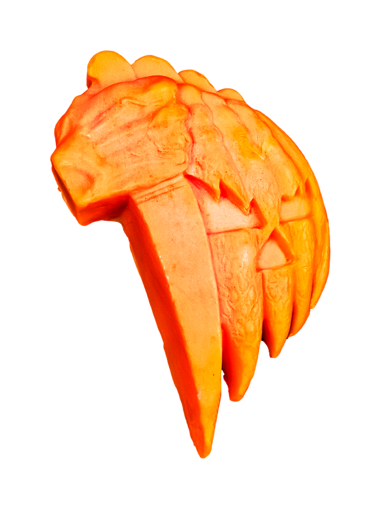 Sculpted soap.  White background. Orange, Hand holding kitchen knife, next to orange and yellow carved jack o' lantern face.