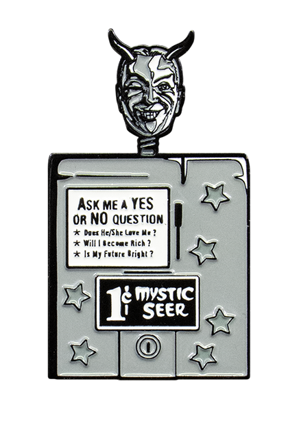 enamel pin. Black and white illustration, man's head and neck, attached to box. Gray hair, black horns on forehead, Black eyebrows, dark slightly closed right eye, left eye wide open, smiling mouth, two white fangs. Box decorated with 6 gray stars, white rectangle on box, text reads Ask me a yes or no question, does he/she love me? Will I become rich? Is my future bright?. Black rectangle, white text reads 1 cent Mystic Seer.